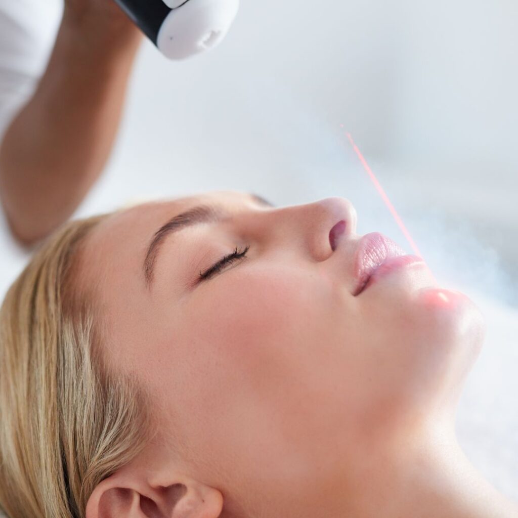 woman getting cryotherapy on face