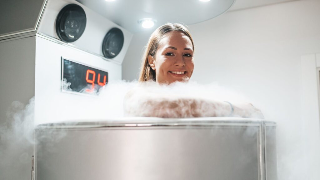 woman smiling in cryotherapy machine