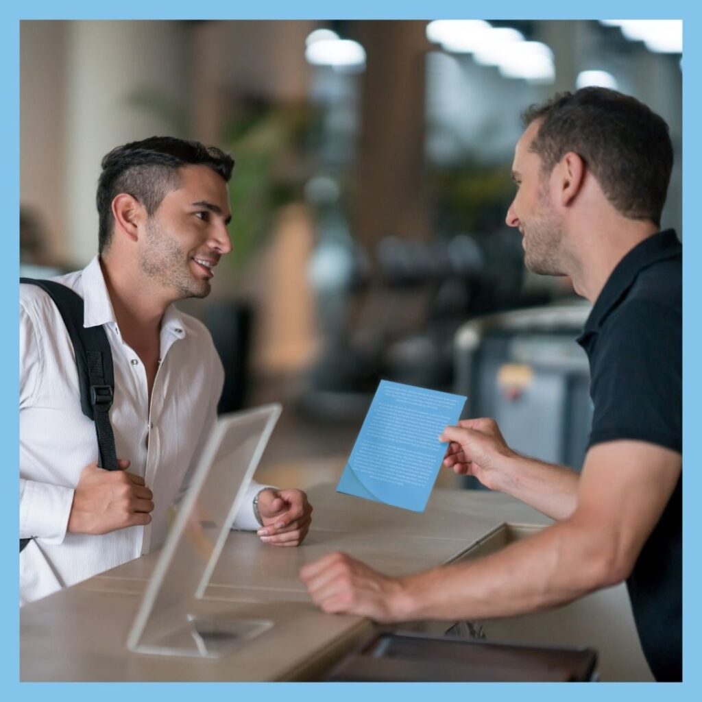 man signing up for gym