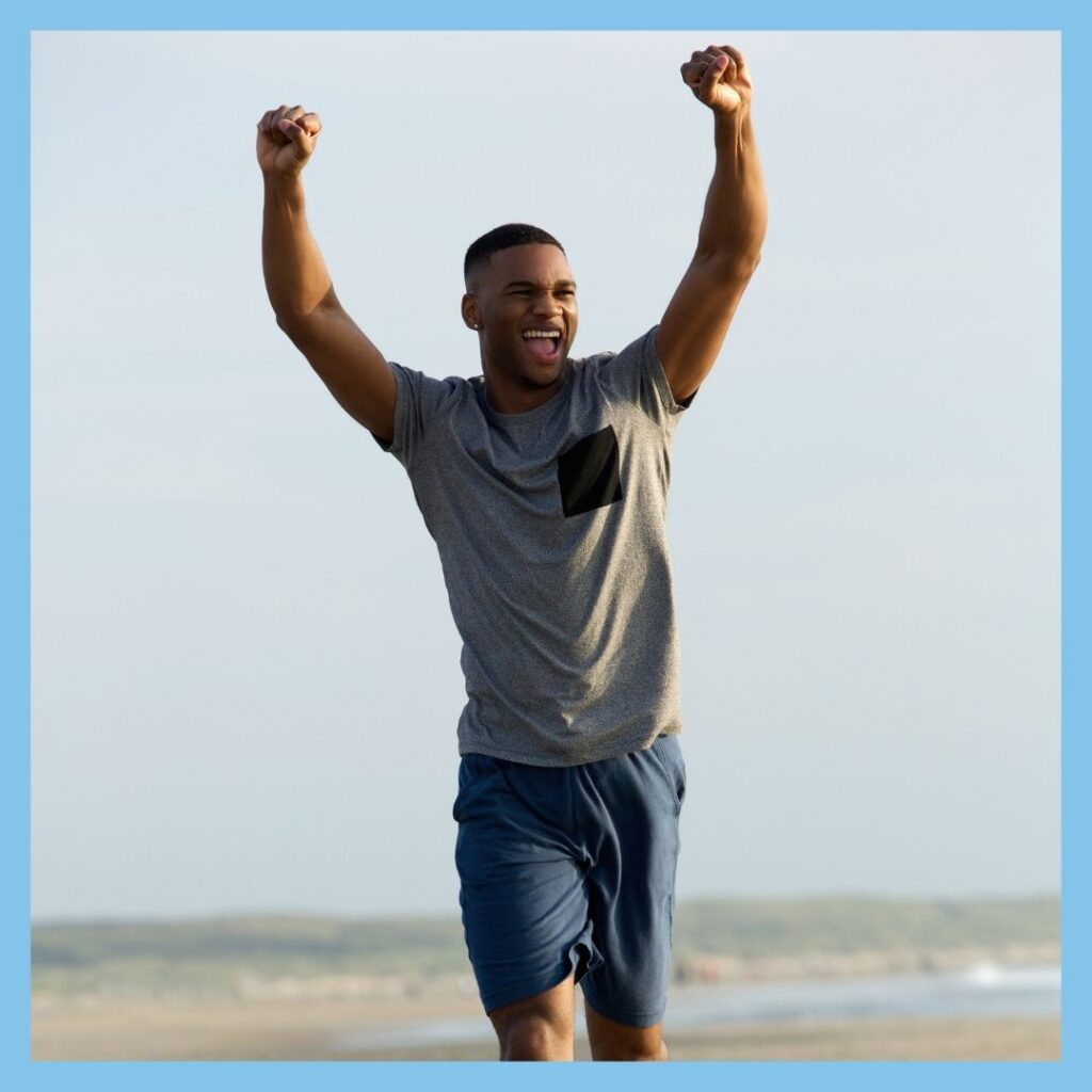 man running outside celebrating